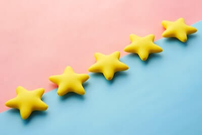 5 gold stars on blue and red background